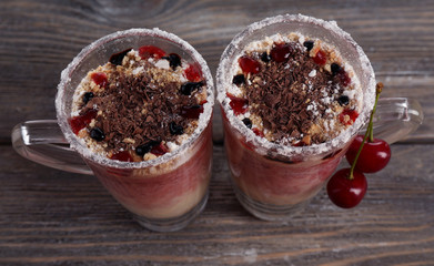 Tasty cherry dessert on table