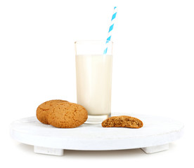 Milk and cookies on wooden tray isolated on white