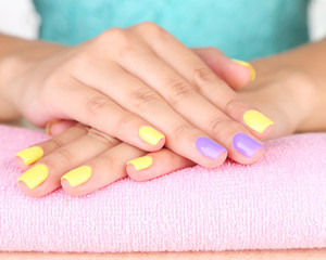 Obraz na płótnie Canvas Female hand with stylish colorful nails,