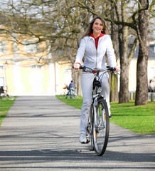 Girl walks city with bicycle