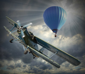 Retro style picture of the biplane and hot air balloon.