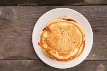 Delicious pancakes on a wooden table