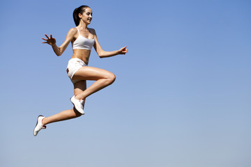 Fototapeta premium Fitness woman exercising in summer park
