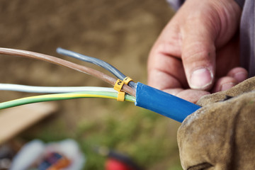 Worker connecting electricity wires