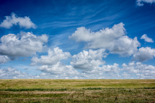 cloudscape above dutch farmland