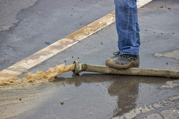 Man pumping away flood water 3