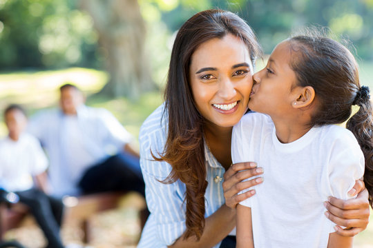 Little Indian Girl Kissing Her Mother