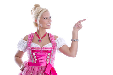 Bayerisches Mädchen im Dirndl mit Zeigefinger isoliert