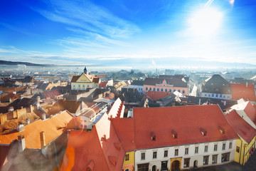 Naklejka na ściany i meble Red roofs and shining sun in Sibiu, Romania