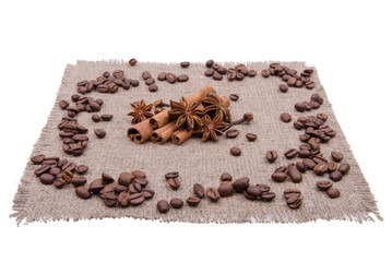Coffee beans and spices on a napkin