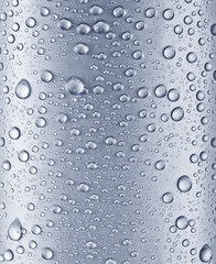 Water drops over blue glass background.