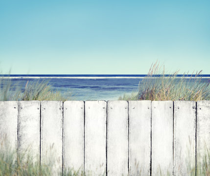 Beach And White Wooden Fence