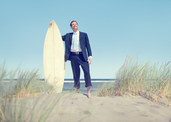 Businessman with Surfboard Standing by the Beach