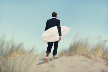 Businessman with Surfboard Going to the Beach