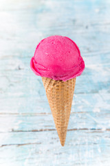 Ice cream scoops on wooden table.