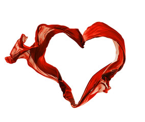 Red satins in heart shape on white background