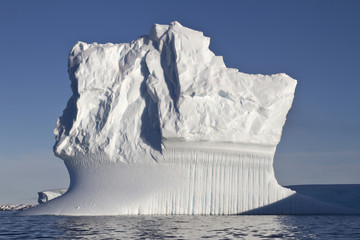 rectangular iceberg sunny summer day in Antarctic waters
