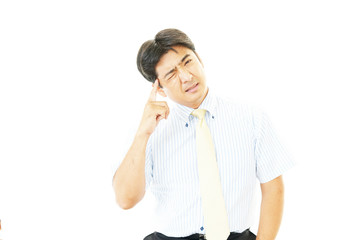 頭痛を訴えるビジネスマン