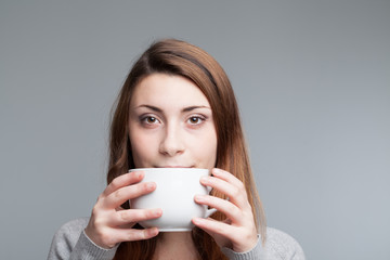 woman holding a coffee cup
