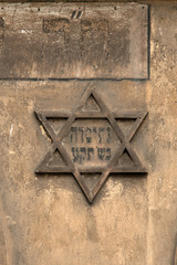 Obraz premium Star of David on the wall of historic Kazimierz, Krakow