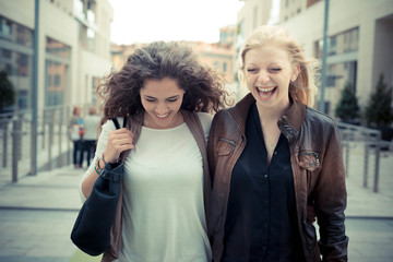 blonde and brunette beautiful stylish young women