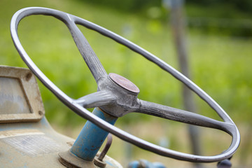 Old blue  tractor details in the vines field