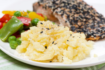 mashed potatoes, pink salmon fillet with sesame and vegetables