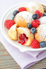 Traditional danish pancakes - ebelskivers with fresh berries