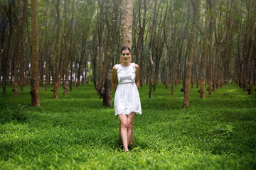 Beautiful romantic woman in enigmatic forest