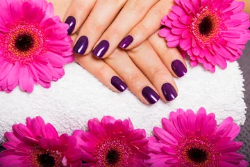 Poster Woman with beautiful manicured purple nails © juniart