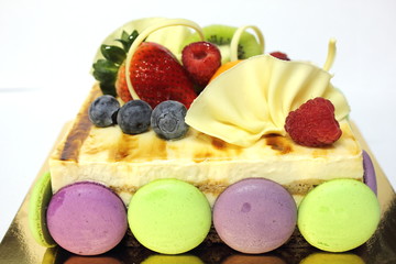 tiramisu  mousse cake and topped with fresh fruit.