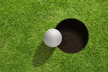 Golf ball near the hole