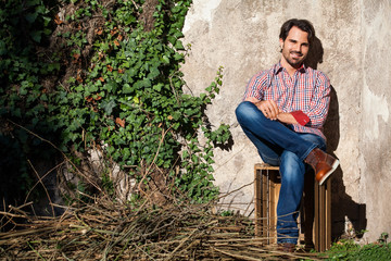 Male model sitting with legs crossed