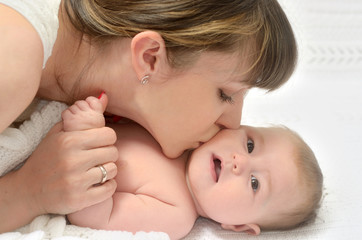 happy mother kissing her baby