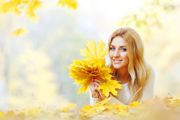 Woman laying in autumn park