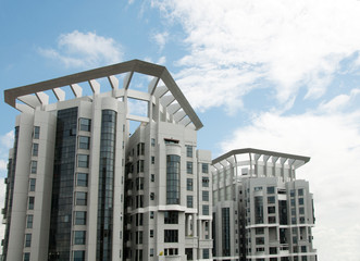 Obraz premium Picture of multiple apartment windows over the sky in Singapore