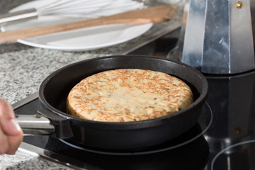 Chef preparing a potato omelette