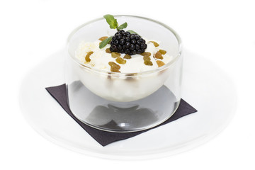 cottage cheese with sour cream and raisins on a white background