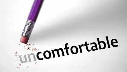 Foto op Plexiglas Eraser changing the word Uncomfortable for Comfortable © klublu