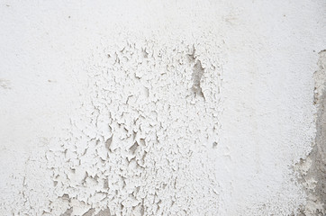 White painted concrete wall surface crack.