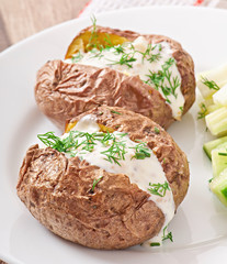 Baked potato filled with sour cream