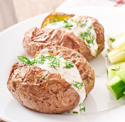 Baked potato filled with sour cream