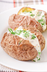 Baked potato filled with sour cream