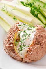 Baked potato filled with sour cream