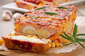 Homemade ground meatloaf with ketchup and rosemary