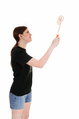 Woman painting wall.