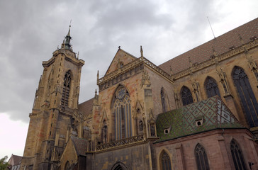 Fototapeta na wymiar St Martin's Church. Rear of the church, with stork nest. Colmar,