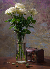 White roses in  vase and box