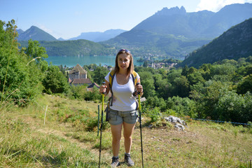 young woman is hiking in the Alps