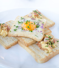 Fried egg inside toast, scrambled eggs